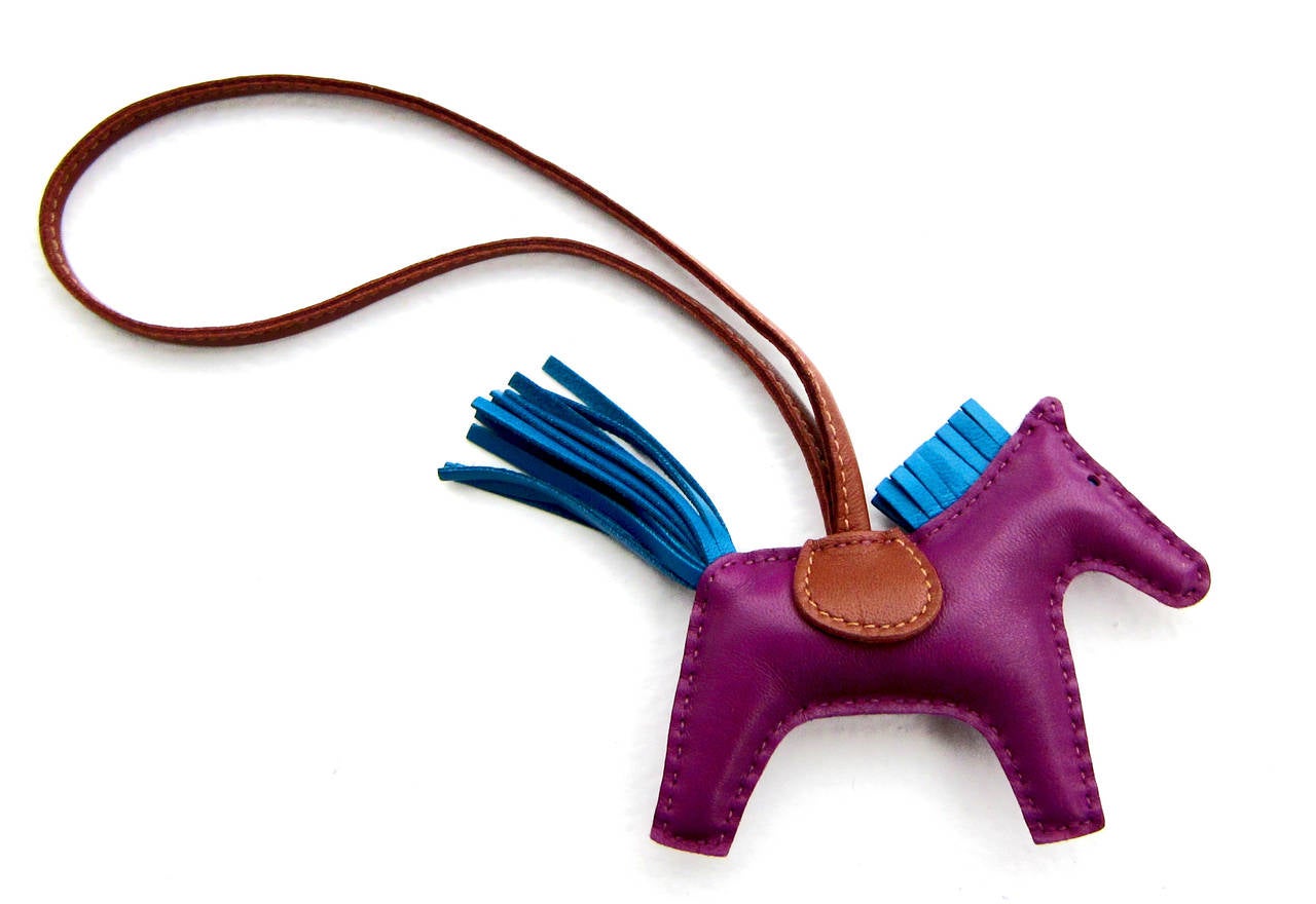 Hermes Rodeo Bag Charm Anemone Blue Izmir Fauve PM Small for Birkin Kelly

Brand new in box. 
Comes store fresh, brand new with Hermes box and ribbon. 
Adorable and fun bag charm 
Extremely hard to find in store and getting more so
Sweetest