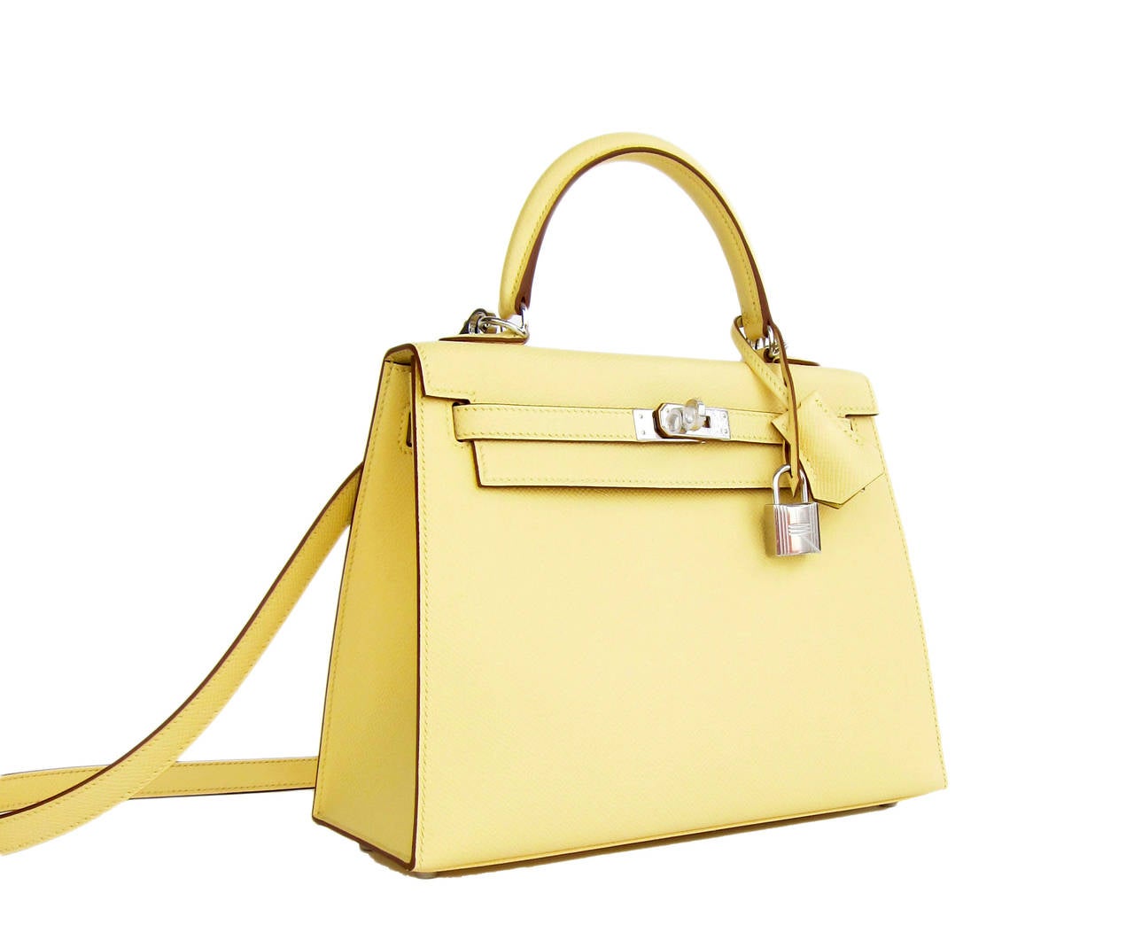 Hermes 25cm Jaune Poussin Sellier Epsom Kelly Palladium Jewel

Brand New in Box- T stamp
Comes full set with keys, lock, clochette, shoulder strap, a sleeper for the bag, rain protector, Hermes ribbon, and original box.
Jaune Poussin is an