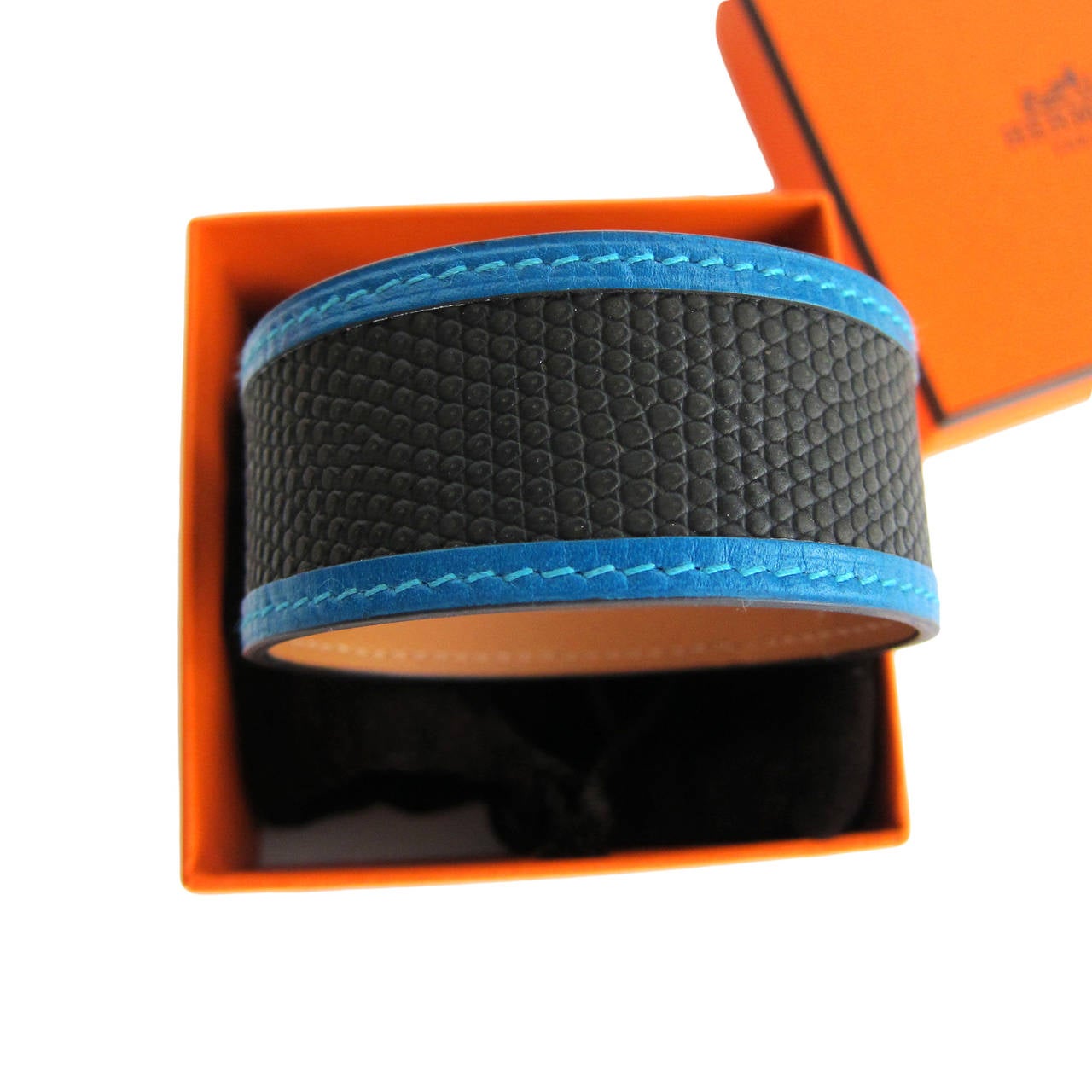 Hermes Black Blue Lizard Calf Leather Petit H Bracelet Cuff One of a Kind

World Exclusive from the Hermes Petit H Collection
Brand New in Box 
Coming store fresh with Hermes pouch, box and ribbon
Lizard and Calf Bracelet Petit H Bracelet
Standard
