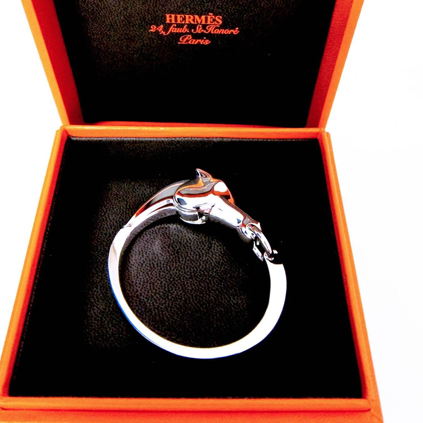 Perfect Gift!  Pristine condition.  Store fresh. 
Comes full set with Hermes box, Hermes ribbon, and gift bag (upon request). 
Features Hermes' modern rendition of the house's famous horse head
Very classic but edgy piece of jewelry. 
A lifetime