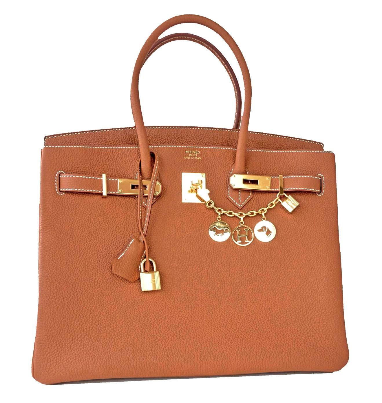 Hermes Gold Camel Tan Togo 35cm Birkin Gold Hardware Iconic Elegant Classic
Brand New in Box.  Store Fresh.  Pristine Condition (with plastic on hardware). 
Just purchased from Hermes store; bag bears new interior X Stamp.
Perfect gift!  Comes