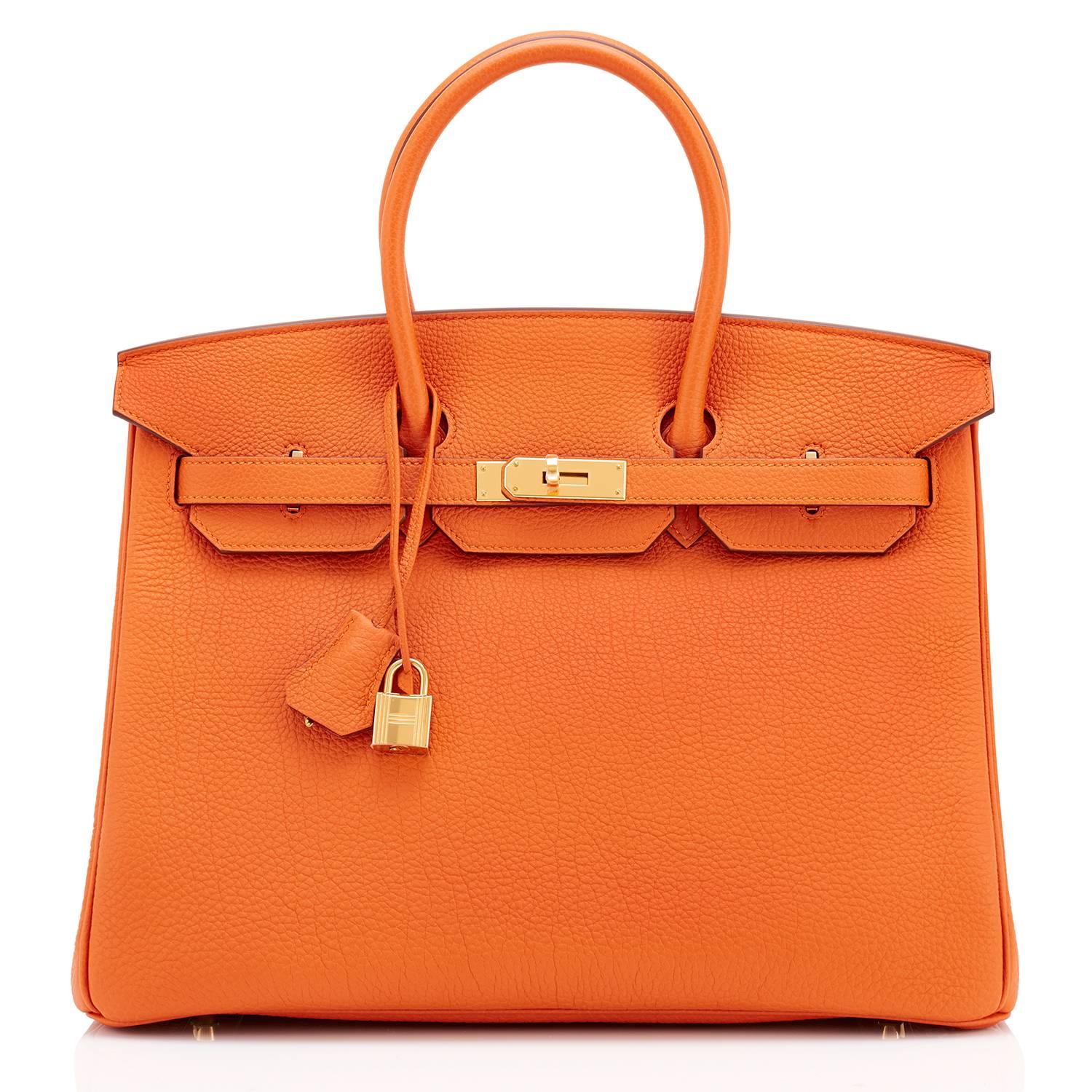 Hermes Classic Orange Togo 35cm Birkin Bag Gold Hardware 
Extremely rare find in New or Never Worn condition (with plastic on hardware). 
Perfect gift!  Comes in full set with lock, keys, clochette, sleeper, raincoat, and Hermes box. 
This is the