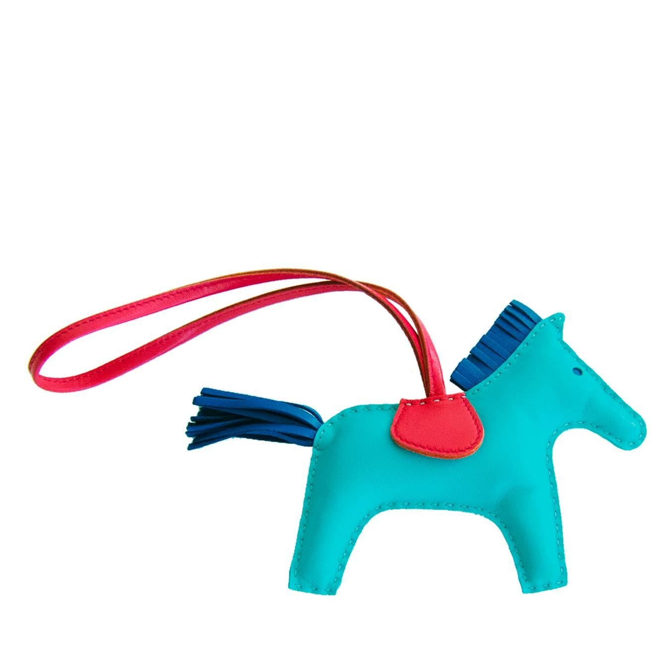 Hermes Lagoon Lagon Rodeo Bag Charm MM For Birkin Kelly

Perfect gift!  Store Fresh.  Pristine Condition.
Comes full set with Hermes box and Hermes ribbon. 
Absolute rarest color combination in the sought-after MM Rodeo Charm
Cult-favorite