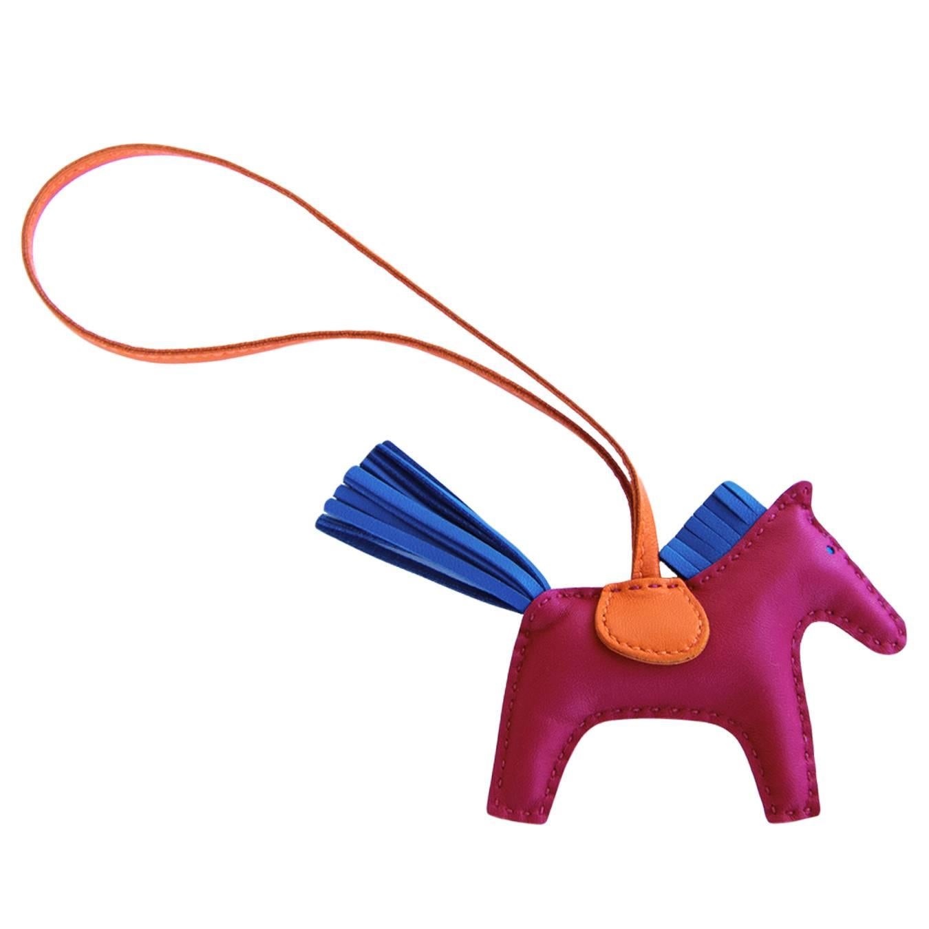 Hermes Tosca Blue Izmir Orange Rodeo Charm PM for Birkin Kelly Bag

Store Fresh.  Never Used in Pristine Condition.
Adorable and fun bag charm 
Very hard to find in store
Rare combination of Tosca (deep pink), Blue Izmir, and Orange
Tosca is a