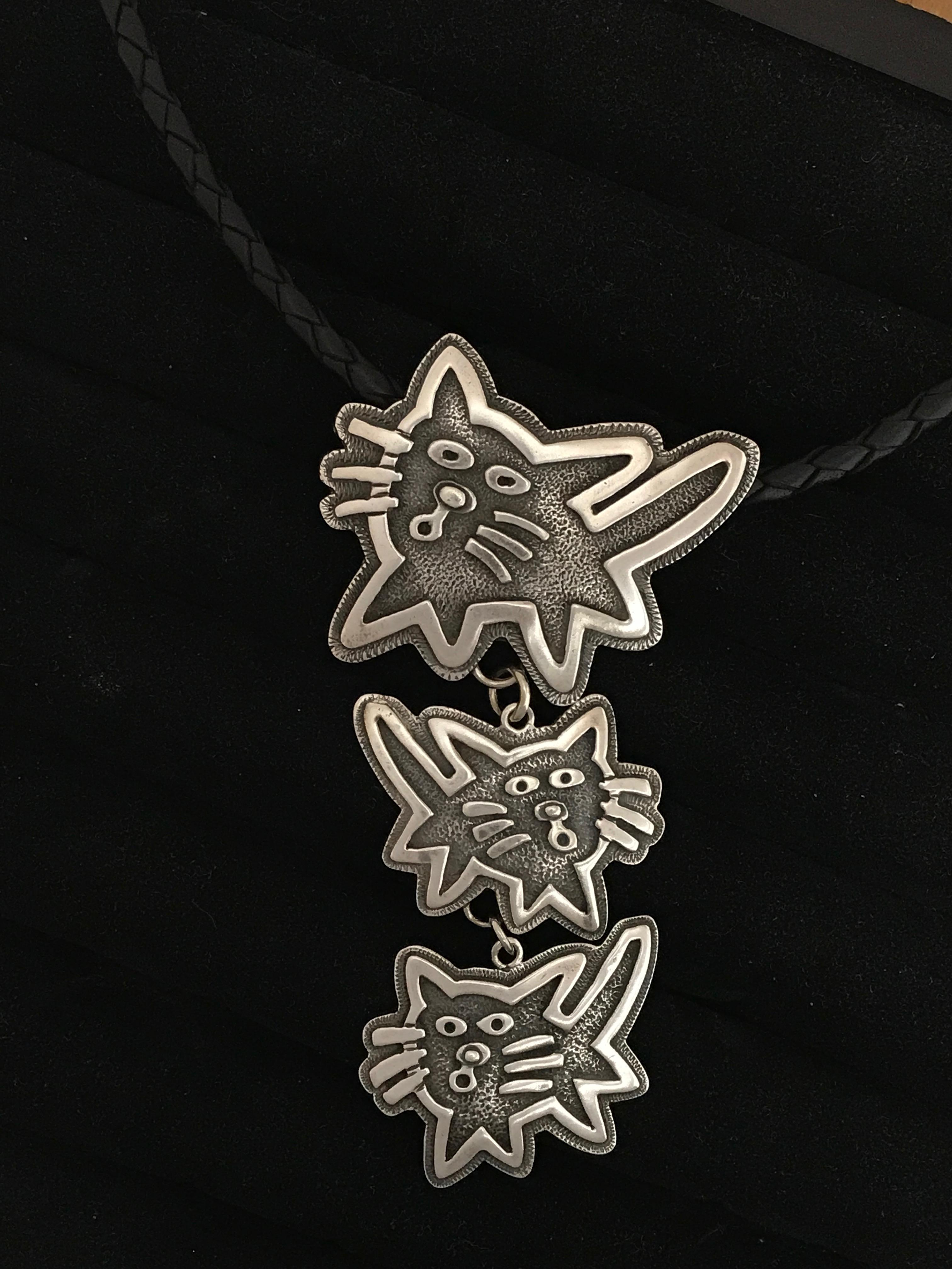 Contemporary Kitty drop necklace pendant, Melanie Yazzie Navajo cast silver cats silver black