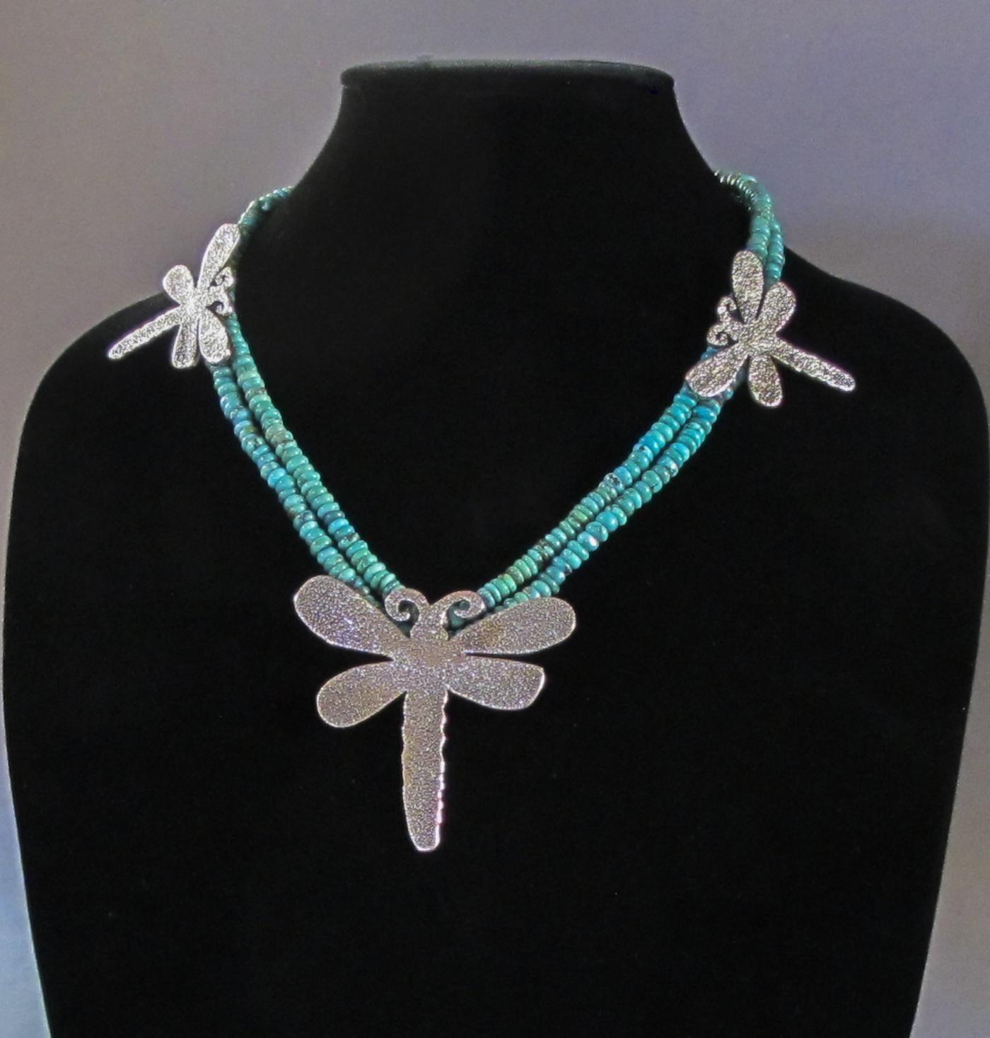 Dragonfly necklace, cast silver Kingman turquoise beads Melanie Yazzie Navajo


Melanie A. Yazzie (Navajo-Diné) is a highly regarded multimedia artist known for her printmaking, paintings, sculpture, and jewelry designs.  

She has exhibited,