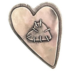 Two Hearts, by Kerry Green, sterling silver, pin, pendant, cast, layered, stitch