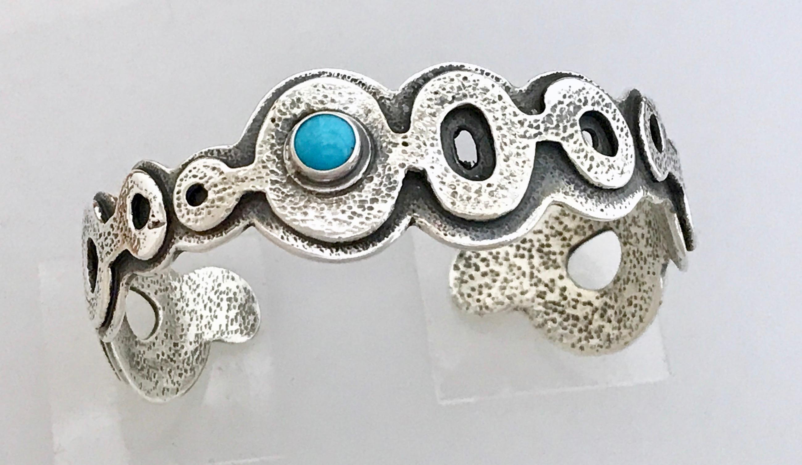 Spirit Pond bracelet, by Melanie Yazzie, Sleeping Beauty Turquoise, cast, silver
Cast sterling silver bracelet with Sleeping Beauty cabochon. 5.5