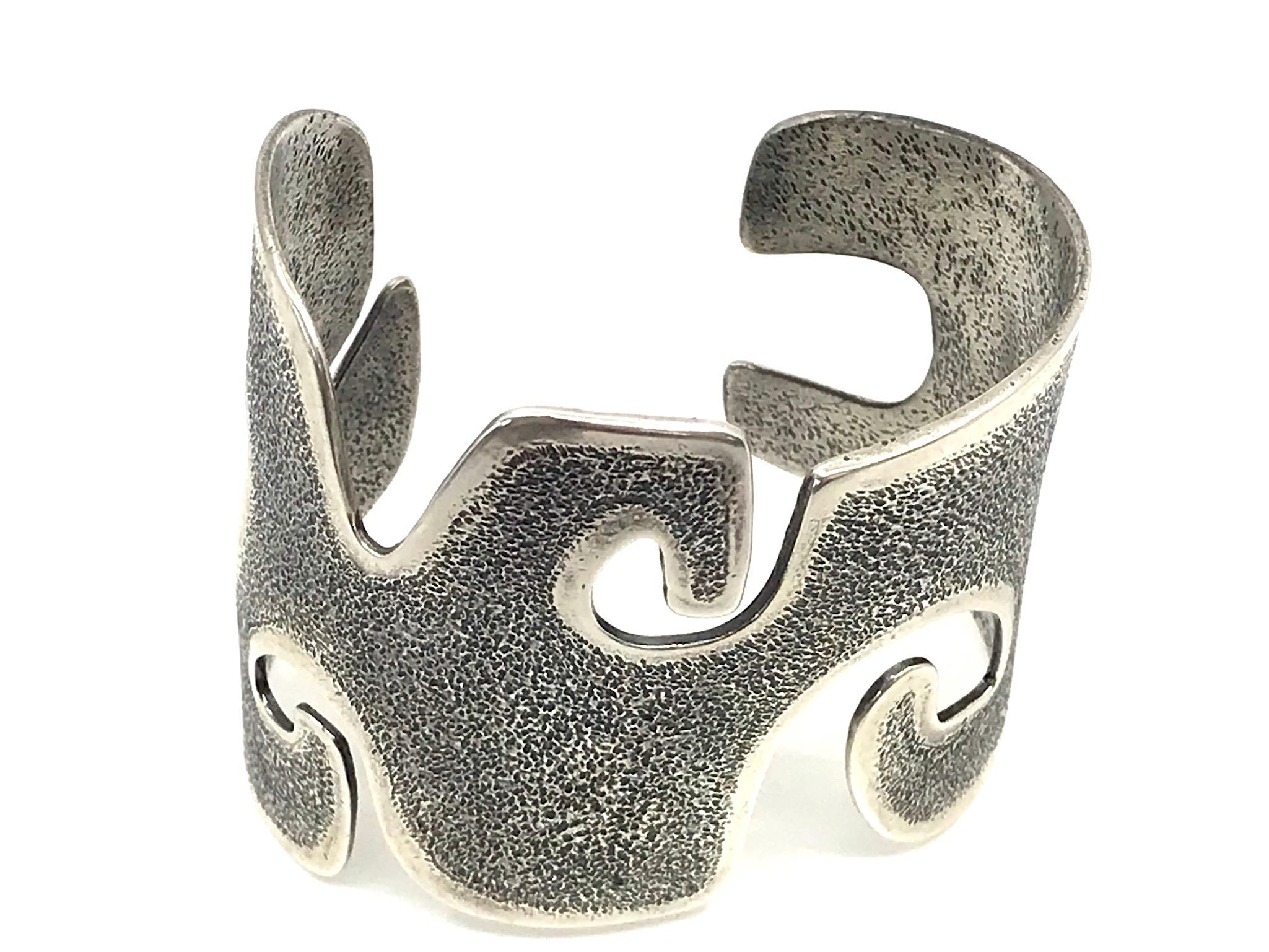Grandmother, Melanie Yazzie contemporary cast silver wide cuff bracelet  Navajo 
This is part of a series of imagery Melanie Yazzie uses in her printmaking, sculptures and jewelry designs. The jewelry designs for Grandmother include this pendant