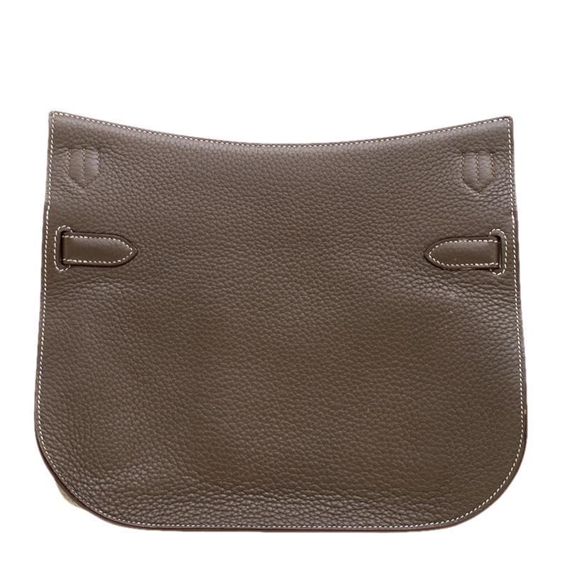 Hermes Jypsiere is a re-interpretation of the iconic Hermes Kelly. The messenger style bag is crafted from Etain Taurillon Clemence leather. The bag has a round bottom and features a thick adjustable shoulder strap that provides the needed comfort.
