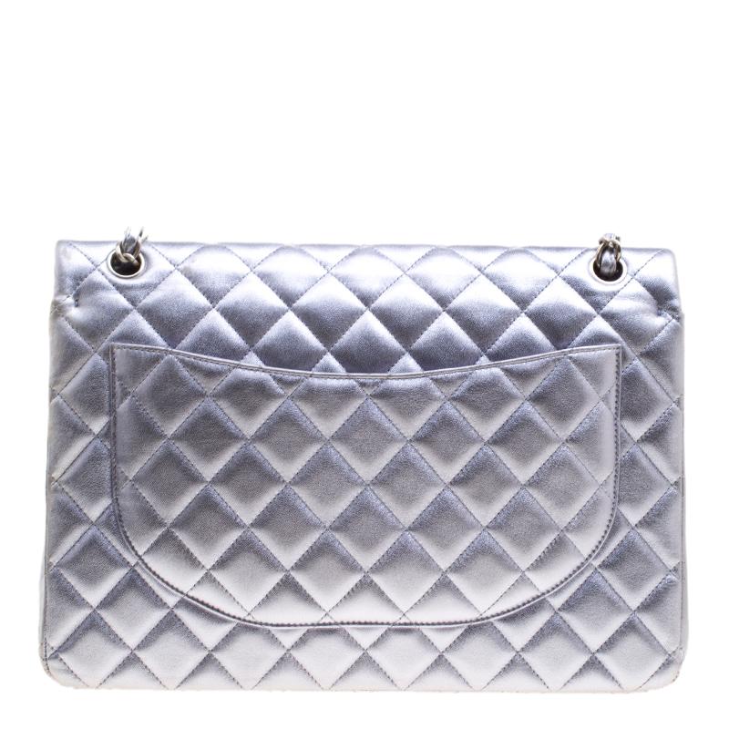 We are in absolute awe of this Classic Double Flap bag from Chanel as it is appealing in a surreal way. With a leather body that is detailed in their signature quilt, the metallic lilac bag brings forth a fine unison of fashion, art, and beauty. It
