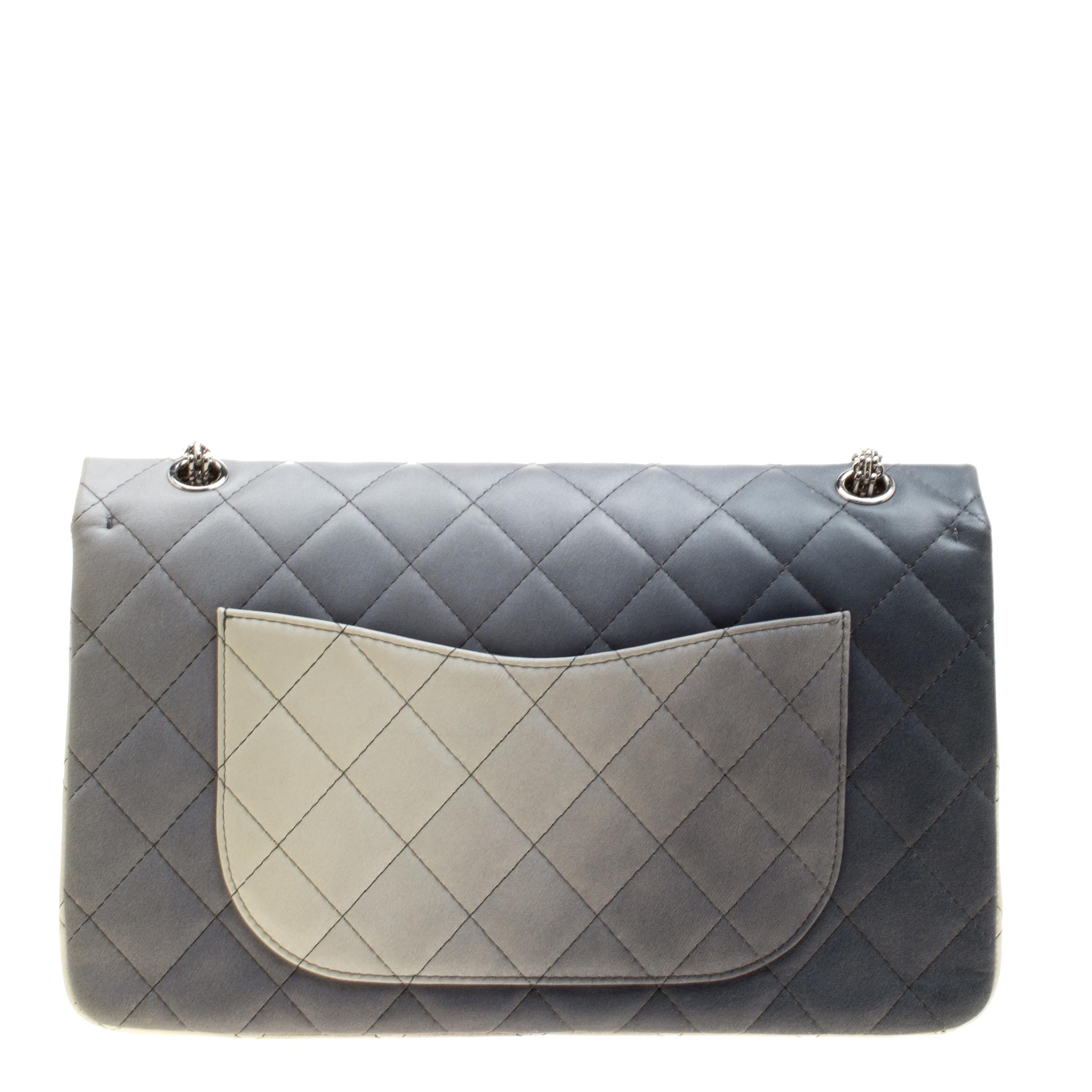 Chanel's Flap bags are iconic and monumental in the history of fashion. This Reissue 2.55 Classic 227 is a buy that is worth every bit of your splurge. Exquisitely crafted from multicolor leather, it bears their signature quilt pattern and the