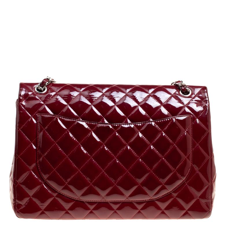 Chanel's Flap bags are the most iconic handbags. The classic double flap bag is crafted from patent leather and features the iconic quilted pattern. It has a chain and leather interwoven strap along with the CC twist lock closure in silver tone. The