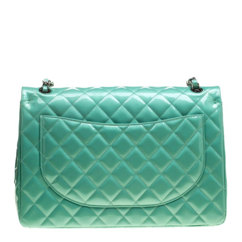 Chanel's Flap bags are the most iconic handbags. The classic green double flap bag is crafted from patent leather and features the iconic quilted pattern. It has a chain and leather interwoven strap along with the CC twist lock closure in gold tone.