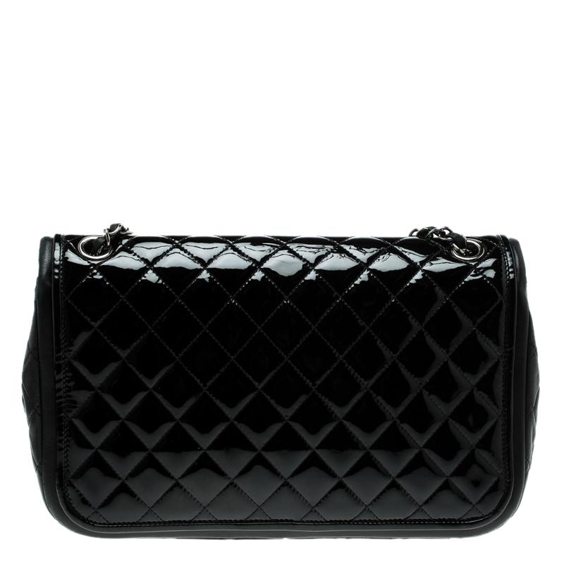 Chanel's Flap bags are the most iconic handbags. Crafted from black patent leather the bag features the iconic quilted pattern. It has a single chain and leather woven strap along with a CC twist lock closure in silver tone. The insides are leather