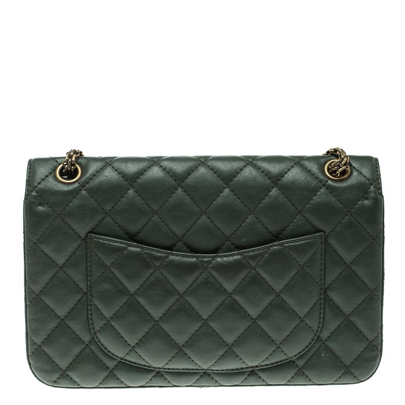 Chanel's Flap Bags are iconic and monumental in the history of fashion. This Reissue 2.55 Classic 226 is a buy that is worth every bit of your splurge. Exquisitely crafted from green leather, it bears their signature quilt pattern and the iconic