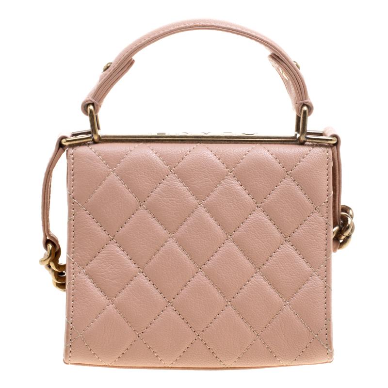 Light up your outfit with this glamorous Rita bag that was part of the Chanel Cruise 2012 bag collection. The bag is crafted from pink leather and features the iconic quilted pattern. The front flap opens to a fabric lined interior that will hold