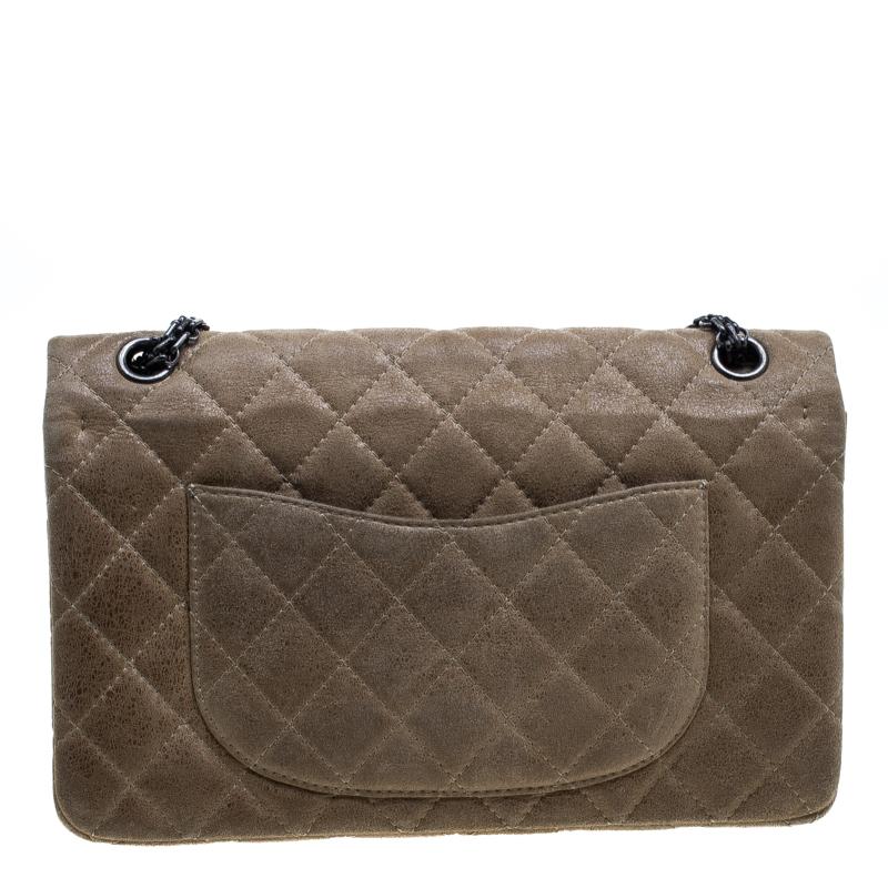 Chanel's Flap Bags are iconic and noteworthy in the history of fashion. Hence, this Reissue 2.55 Classic 226 is a buy that is worth every bit of your splurge. Exquisitely crafted from glazed suede, it bears their signature quilt pattern and the