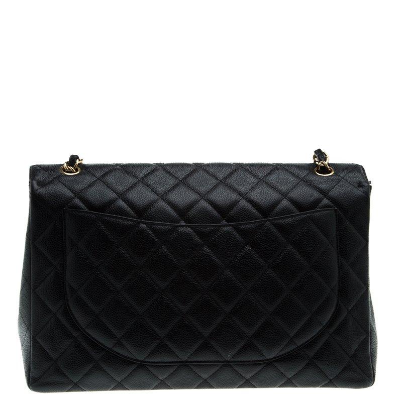 Chanel's Flap Bags are the most iconic handbags. The Maxi classic bag in black color has a quilted pattern. It has an interwoven golden chain and leather strap along with a CC twist lock flap closure.The bag opens to a leather lined interior with
