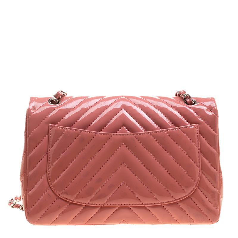 We are in absolute awe of this Classic Flap bag from Chanel as it is appealing in a surreal way. With a leather exterior that is detailed in a chevron quilt, the pink bag brings forth a fine unison of fashion, art, and beauty. It boasts the iconic