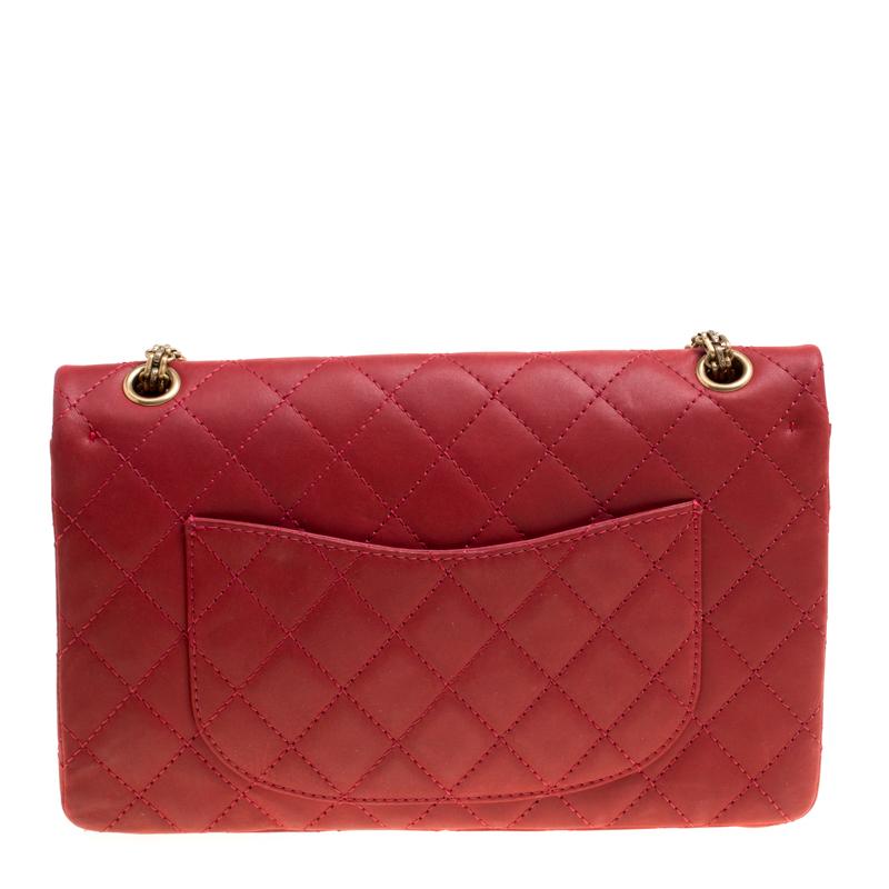 Chanel's Flap Bags are iconic and monumental in the history of fashion. This Reissue 2.55 Classic 226 is a buy that is worth every bit of your splurge. Exquisitely crafted from red leather, it bears their signature quilt pattern and the iconic