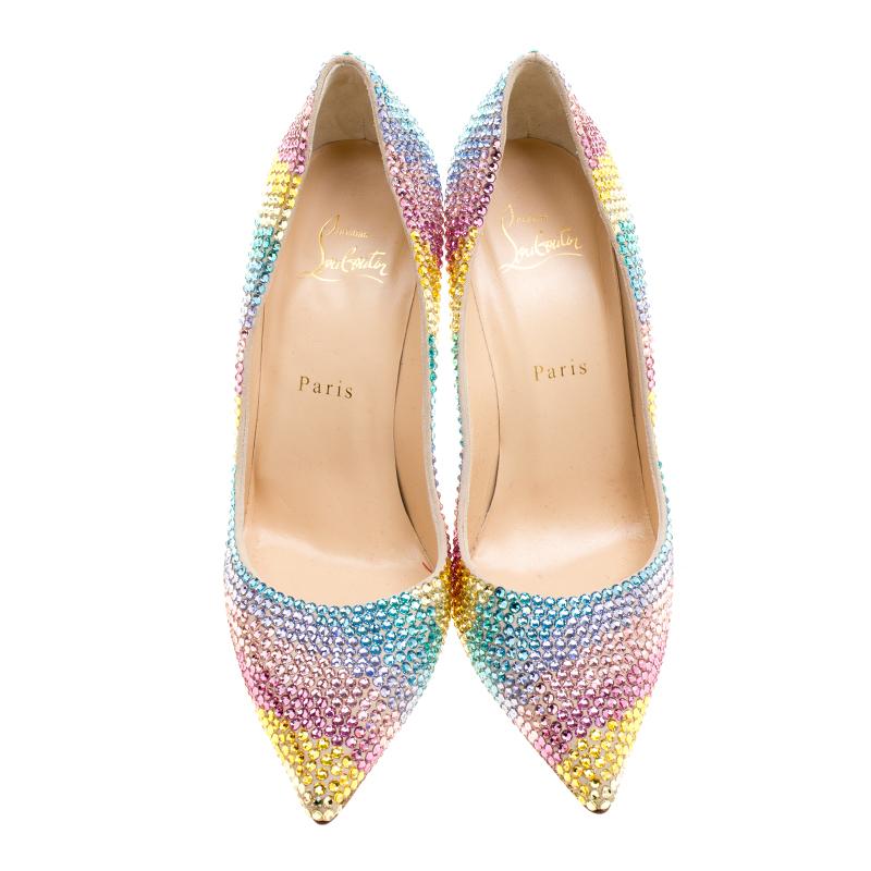 Add a pop of color to your wardrobe! This pair of pumps from the house of Christian Louboutin are crafted with care to reflect your inner diva. These pointy-toes pumps are enhanced with sparkling crystal embellishments all over he surface that will