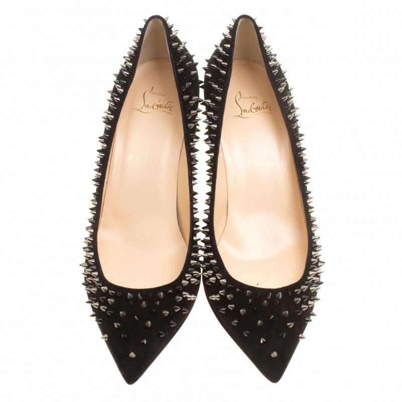 The eye-catching Escarpic spikes against the black suede base make these Christian Louboutin pumps a stellar worth possessing. This statement-making pair features the timeless elegance and coveted style of the label and is designed with feminine