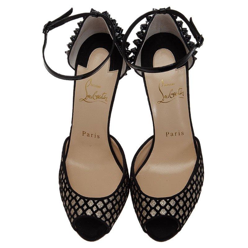 Step in these Louboutin heels worthy of royalty. They feature stylishly designed vamps crafted from black suede with silver flocked details, almond peep toes and spiked leather counters. They come with adjustable ankle straps and 11cm long heels