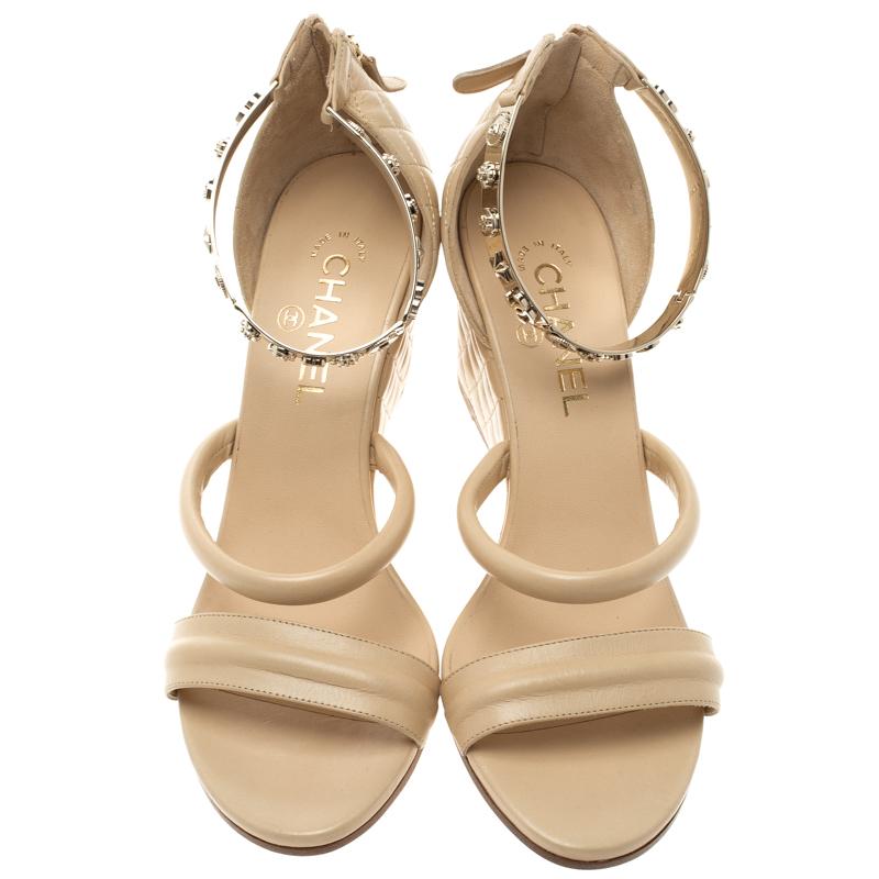 A beautiful pair of wedges will take you through the day and even in the night with the comfort of walking in them, these Chanel wedge sandals perfectly combine style with luxury. Constructed in beige leather, the wedge heel and back support feature