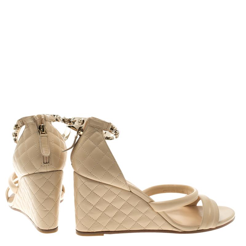 Chanel Beige Quilted Leather Charm Embellished Ankle Cuff Wedge Sandals Size 40. In New Condition In Dubai, Al Qouz 2