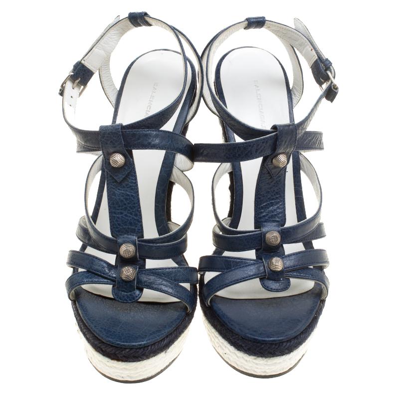 This pair of wedge sandals by Balenciaga is lovely. They've been wonderfully styled with leather straps, stud detailing and elevated on 13.5 cm espadrille wedges. Complete with comfortable leather insoles, this pair is a must-have.

Includes: