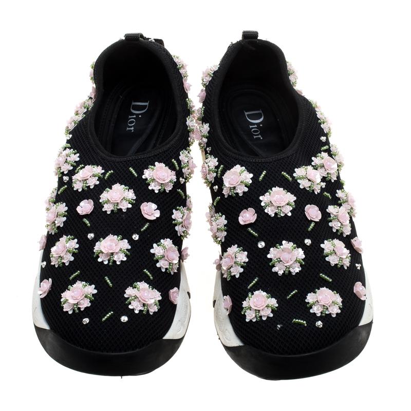 These Dior Fusion slip-on sneakers styled with a black mesh exterior will keep you comfortable with a feminine glam style. Featuring beautiful floral embellishments all through the surface, these shoes are complete with rubber soles that are