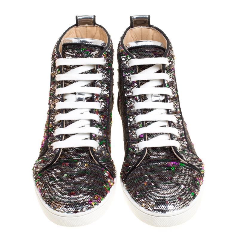 A high-fashion take on a practical style, these Bip Bip Orlato sneakers from Christian Louboutin are styled in a high-top silhouette with shimmery two-tone sequins embellished all over the exterior. They feature contrasting lace-up vamps and