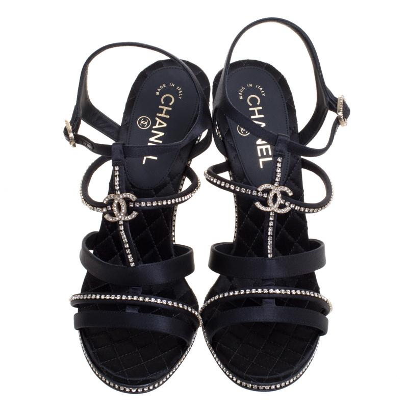 Chanel's designs come with a style that leaves all in awe. Take a look at these sandals! They've been crafted from satin in a strappy layout and styled with crystal embellishments and the signature CC. The pair is complete with ankle fastening and