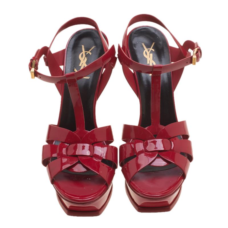 Colourful enough to wear with your day looks and chic enough to dress you up for the night time, these Saint Laurent Paris Tribute sandals are versatile and effortlessly stylish. Constructed in red patent leather, these sandals feature a chunky