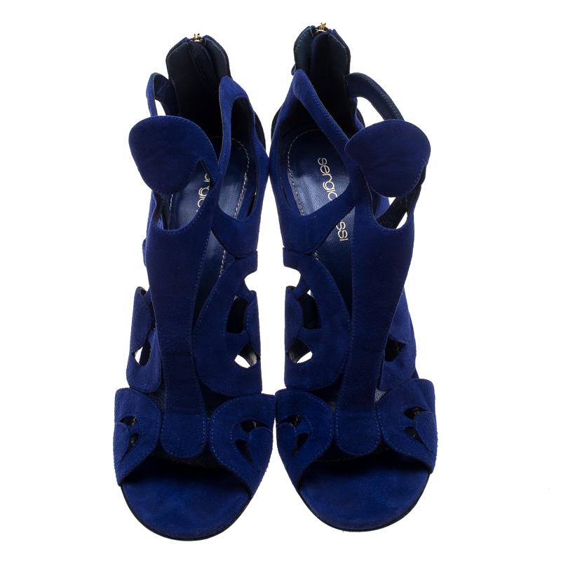 Crafted exquisitely from suede and designed with cutouts, these Sergio Rossi sandals were built to lift your outfits and your spirits. Zippers are detailed on the counters, and the sandals are balanced on beautifully sculpted 11.5 cm