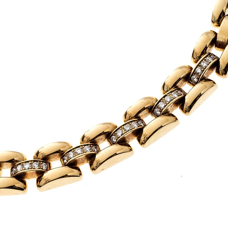 This La Strada necklace from the house of Chopard will perfectly complement that bare shoulder, evening gown that you have been eyeing to wear. This necklace features 3 rows of gold bars with 36 links and crafted from an 18k yellow gold chain. It is