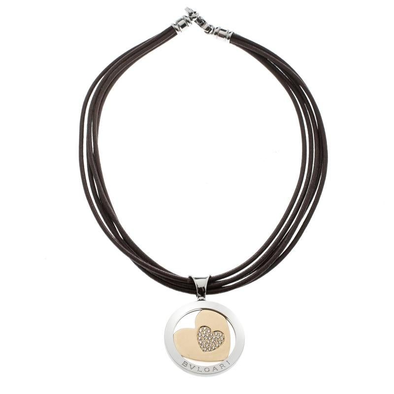 For times when you fancy a slightly edgy look over an elegant appearance, Bvlgari brings you this stunning Tondo heart necklace that has a circular stainless steel pendant with an 18k yellow gold heart within it. The piece has been graced with a