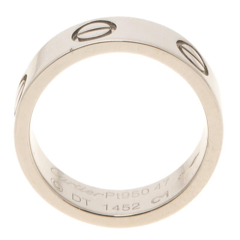 Part of the 'Love' collection, this Cartier band features a platinum body with a wide silhouette. It comes detailed with screw motif all around it- one of the label's signature. The simple yet elegant style makes it an easy, everyday