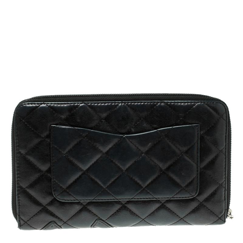This Chanel Cambon long wallet is conveniently designed for everyday use. Crafted from leather, the quilted wallet has a zip closure that opens to reveal multiple card slots and a zip pocket for you to neatly arrange your necessities. This stylish