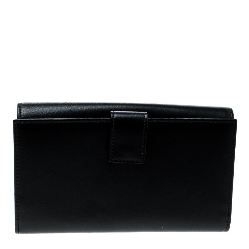 This wallet version of the famous Peekaboo bags from Fendi exudes similar extravagance and style. Crafted in Italy from black leather, the wallet features gold-tone, logo embossed twist lock closure and a foldover top that opens to a sizeable