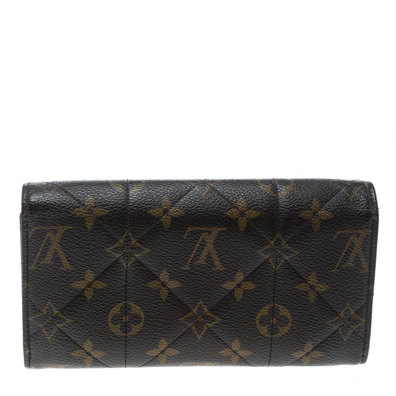 Etoile Sarah is a popular classic wallet by Louis Vuitton. Made from signature Monogram canvas the turn lock closure opens to an expanse with multiple card slots, open compartments to arrange currency and a zip coin pocket. Perfect in size, it can