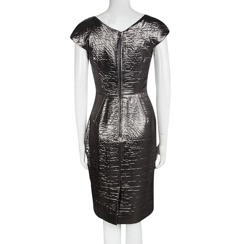 One glance and you'll fall in love with this shimmering metallic dress from Dolce and Gabbana.. The sheath dress is made of a silk blend and features a textured pattern all over it. With a well defined silhouette, it flaunts a rectangular neckline,
