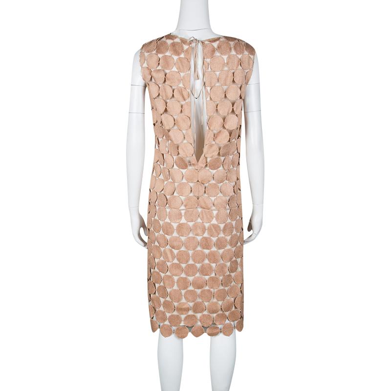 This shift dress is a testimony of Marni's wonderful approach to fashion. This cotton-blend dress is meticulously designed with circular Guipure lacework that creates an overlay. A sleeveless design, it is equipped with a round neckline and