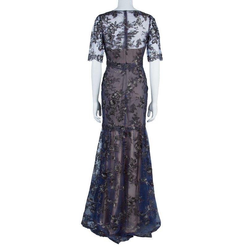 Be the belle of the ball in this sleek Notte By Marchesa gown that's perfect to attend a wedding or any fancy event. The dress features a fitted bodice with a black Appliqué sheath over a shoulder-less polyester lining. It comes with a tiered layer