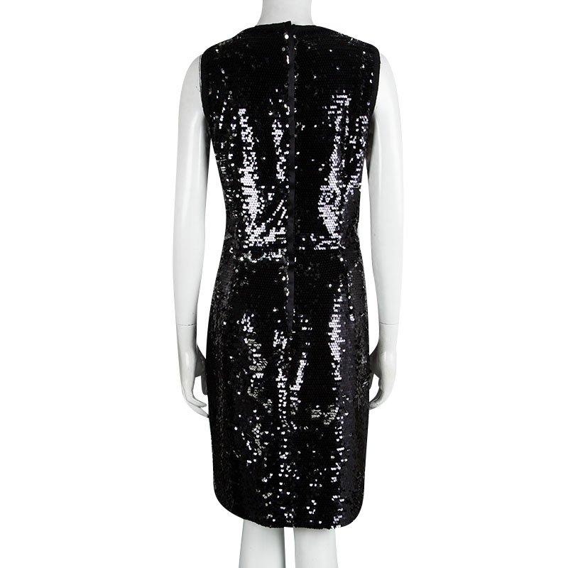 Dolce & Gabbana's black dress is embellished with tons of black sequins to really let it shine without the need for any accessories. Featuring a signature feminine silhouette, this knee length dress will steal the show at your evening soirees.