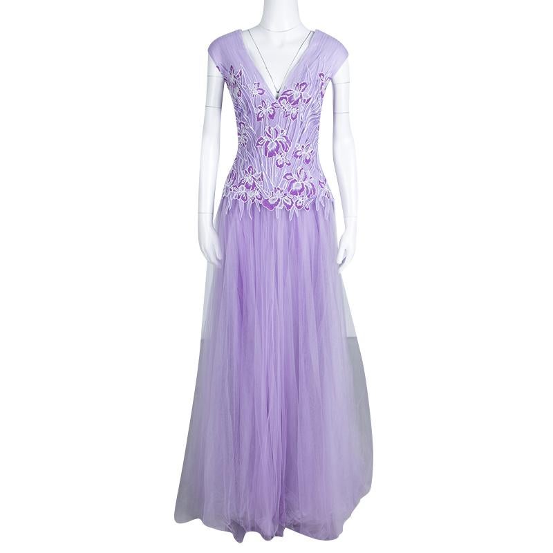 Make a grand entrance in this Atataka gown from Tadashi Shoji. This floor-length gown with the embroidered floral details on the bodice and tulle bottom creates a strikingly feminine look. Flaunting a soft lilac hue, create a stunning style