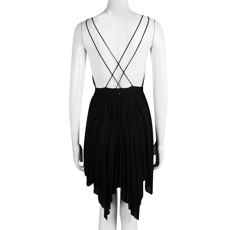Do you want an LBD with a difference? This Balmain creation is little, black and one stunner of a strappy, backless dress. A triangular front resembling a bib takes away from the deep V neckline that reaches the waist. The handkerchief hem from the