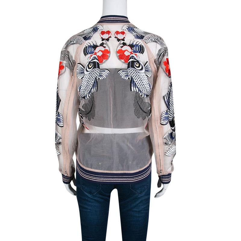 We are simply smitten by this bomber jacket from 3.1 Phillip Lim! Isn't it stunning? The detailing on it is top class and just takes the beauty of the jacket to a higher level. In an organza body, natural tattoo embroidery spreads out from the
