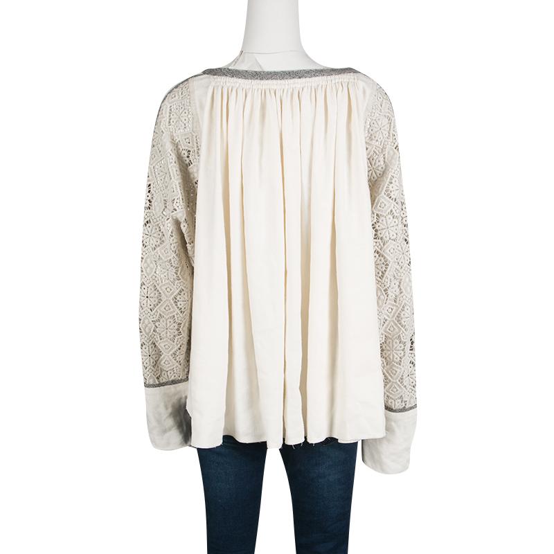 Saint Laurent Paris's blouse in muted cream hue and pleated pattern exudes feminity and style in equal measure. It is made in the blend of finest fabrics that gives it an elegant finish. The blouse features contrasting trims and guipure lace detail